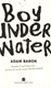 Boy underwater by Adam Baron